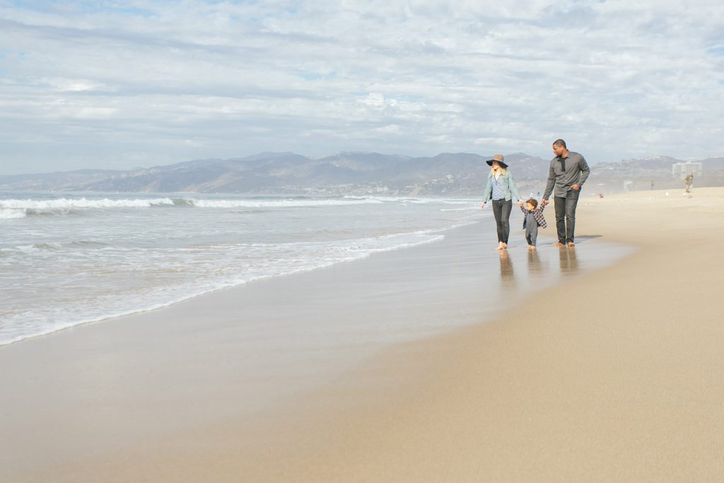 Young family on a southern California beach in Santa Monica. Family photography by Birchblaze