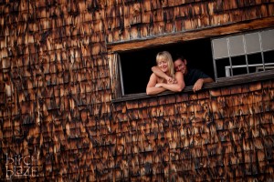 Couple in an old barn window. New Hampshire Family Photographers - Birch Blaze Studios