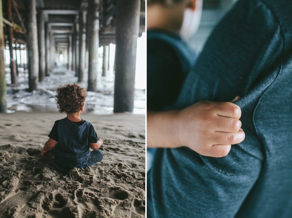 Little Boy sitting in the sand beneath the Santa Monica Pier, Southern California family photography by Birchblaze.