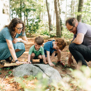 Young family on a treasure hunt in NH, NH family portraits by Birch Blaze Studios.