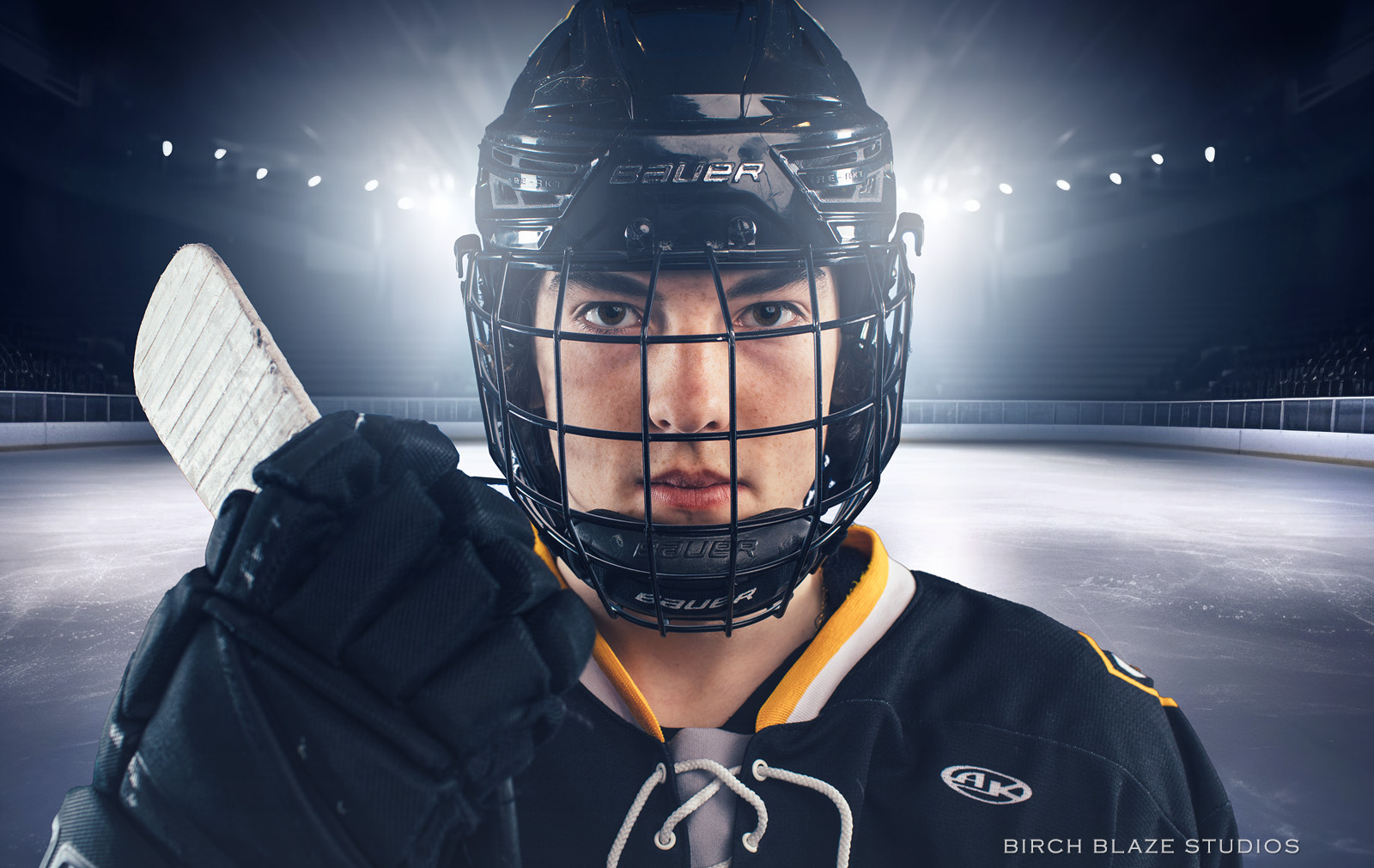 Young hockey player, youth athlete. Sports portrait created by NH portrait photographers, Birch Blaze Studios. © 2023 Birch Blaze Studios. All Rights Reserved.