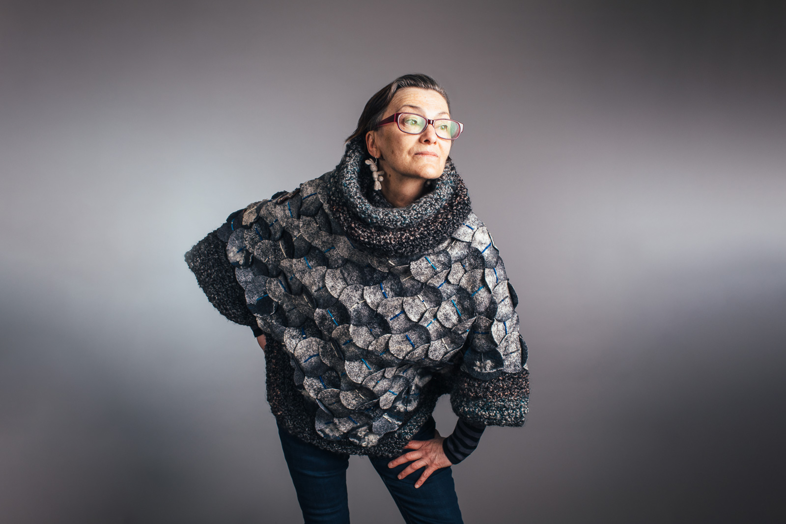 2023 Upcycled Fashion Show portrait by portrait artist, Kerry Struble, of Birch Blaze Studios located in Wakefield, NH. Upcycled poncho with extendable hood.